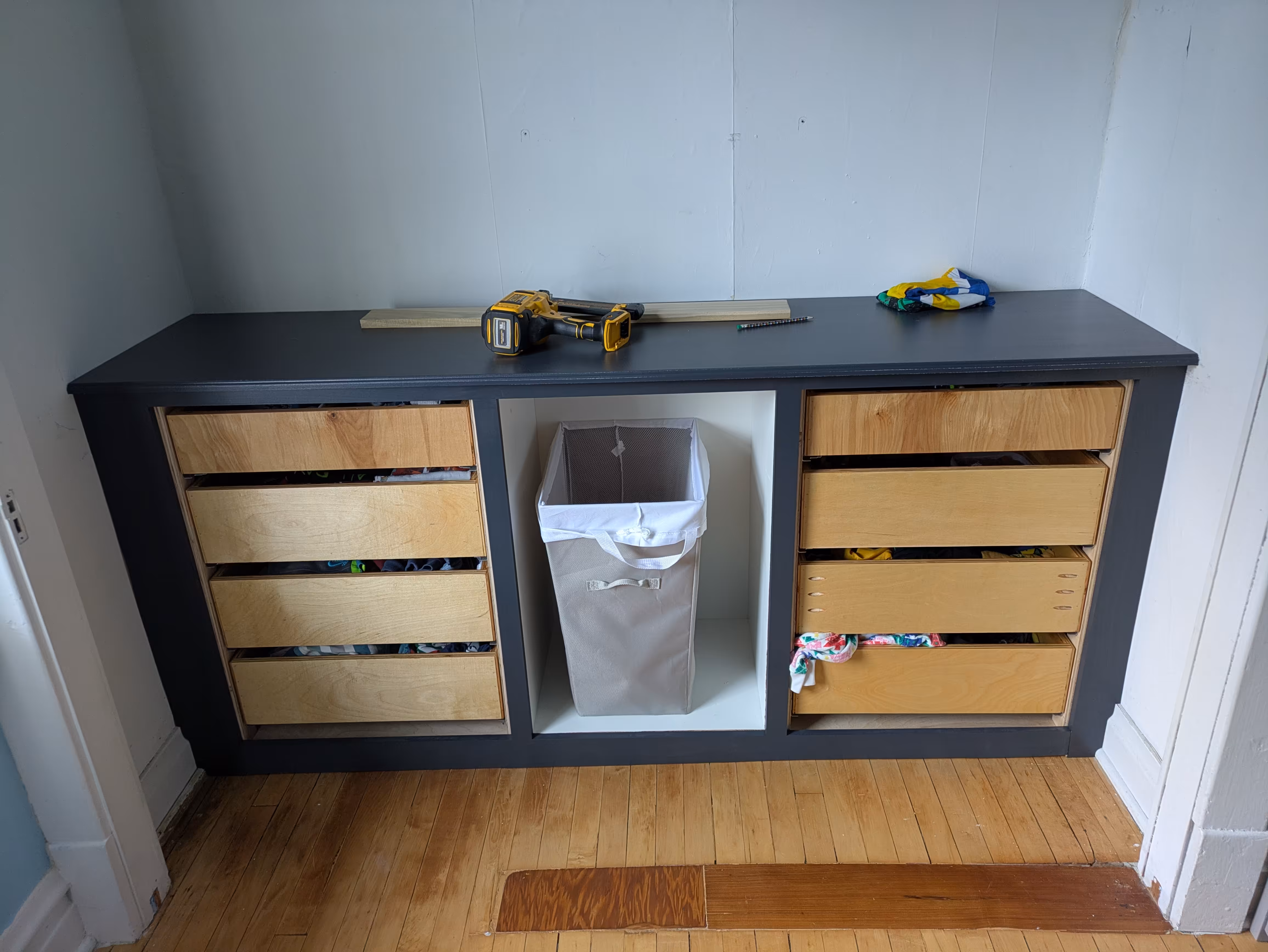 Custom built-in drawers and shelves in a kids bedroom.