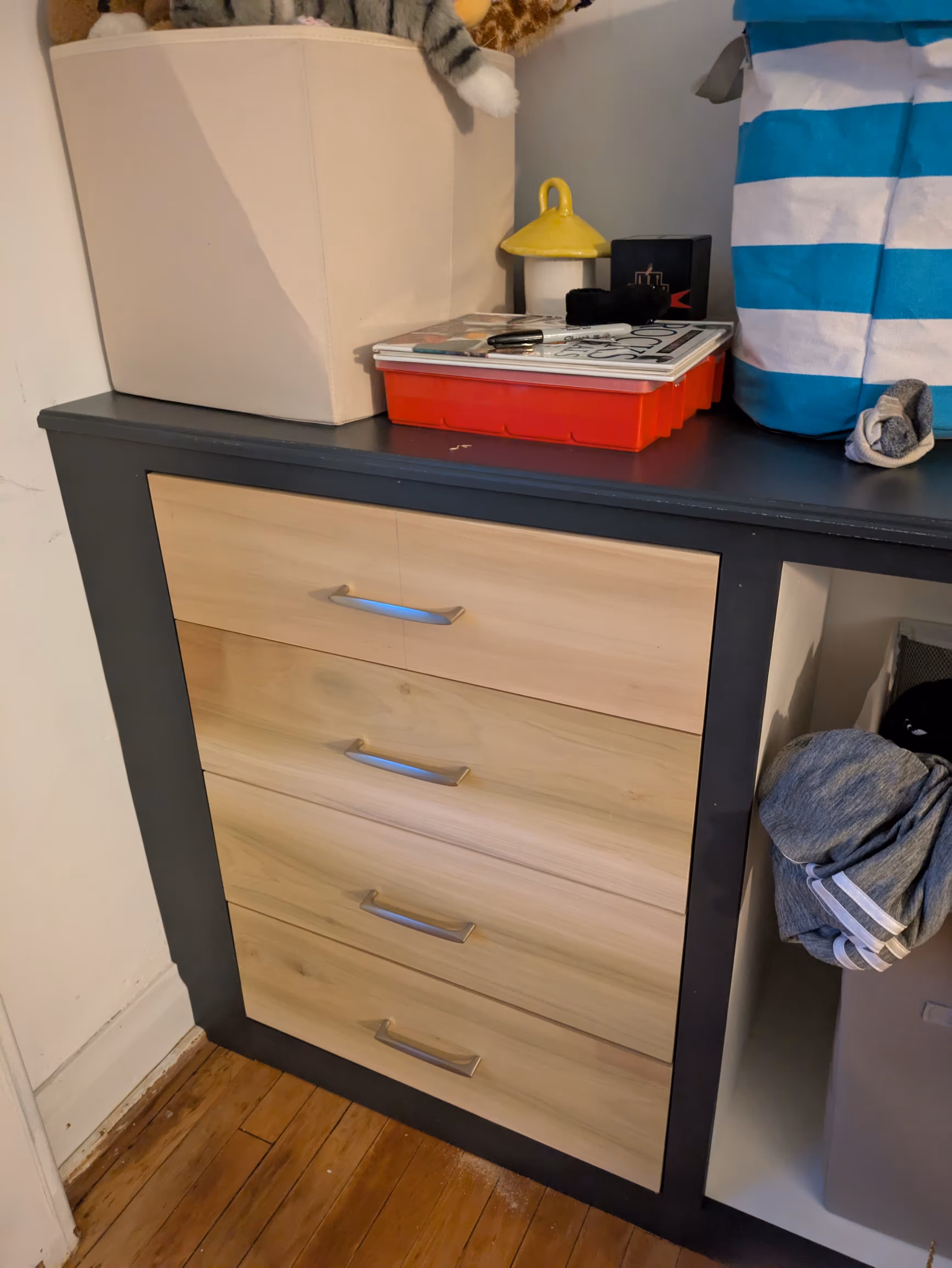 Detail view of the built-in upper cabinet doors and mid-height open shelving.